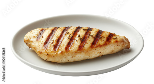 Juicy grilled chicken fillet served on a simple white plate for a delightful meal experience photo