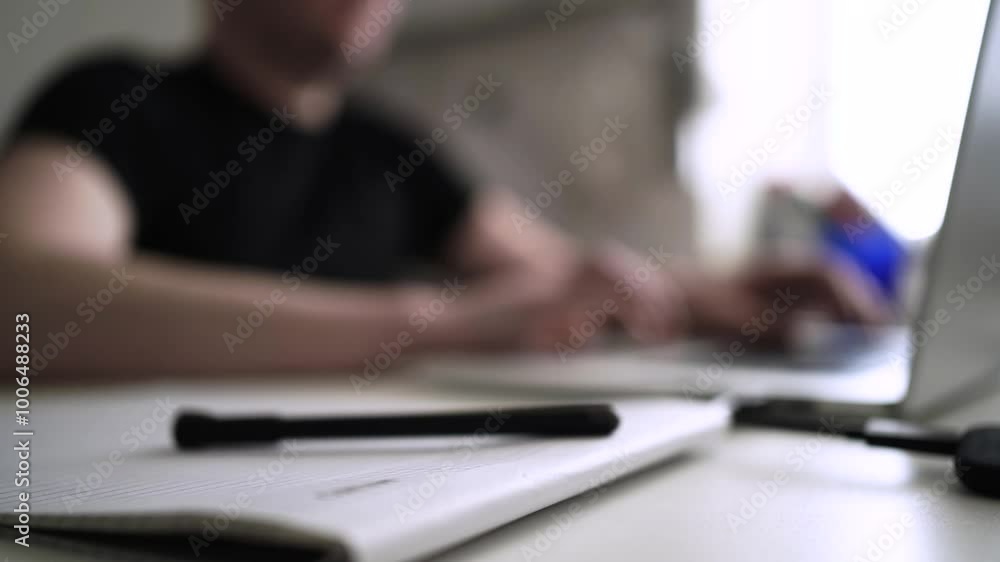 Man journaling thoughts into notebook Man journaling thoughts into notebook