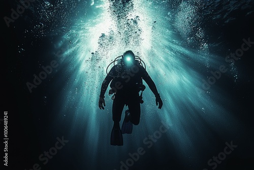 Wallpaper Mural Silhouette of a Diver Ascending Through a Sunbeam in the Ocean Torontodigital.ca