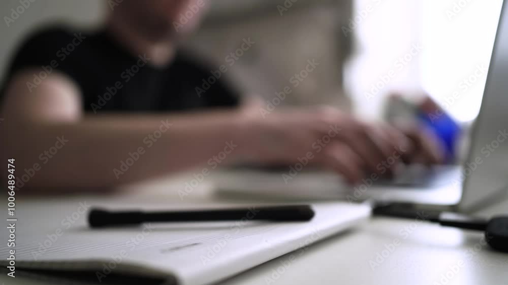 Man journaling thoughts into notebook Man journaling thoughts into notebook