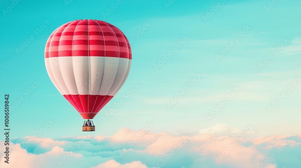 Fototapeta premium A vibrant hot air balloon glides gracefully over fluffy white clouds, offering a stunning view of the clear blue sky and a sense of adventure.