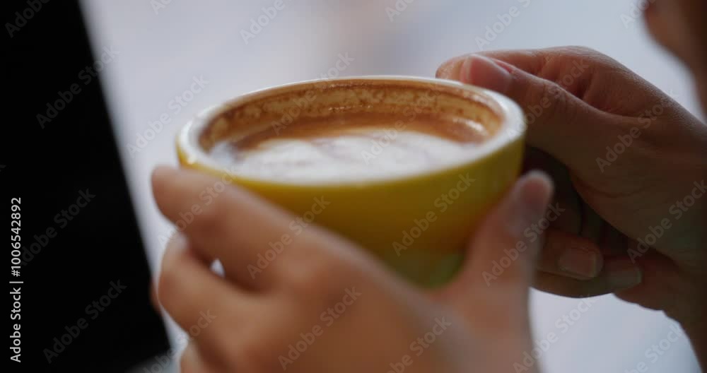 Young business woman having a delicious cup of coffee and working with laptop and phone in a city center cafe, well-deserved break between tasks, working remotely, online store, entrepreneur Young business woman having a delicious cup of coffee and working with laptop and phone in a city center cafe, well-deserved break between tasks, working remotely, online store, entrepreneur