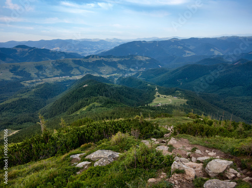 silhouettes of the Chornohirsky ridge, from rocky slopes, trail, perspective from the air in the distance, Carpathians, Ukraine photo