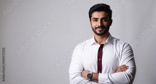 Charming Middle Eastern male model in studio portrait on simple white backdrop