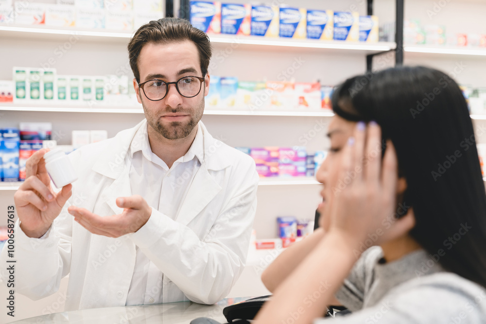 Confident smart male pharmacist druggist advising remedy, painkillers, drugs, medicines, pills for a female customer client buyer suffering from headache migraine in pharmacy drugstore Confident smart male pharmacist druggist advising remedy, painkillers, drugs, medicines, pills for a female customer client buyer suffering from headache migraine in pharmacy drugstore