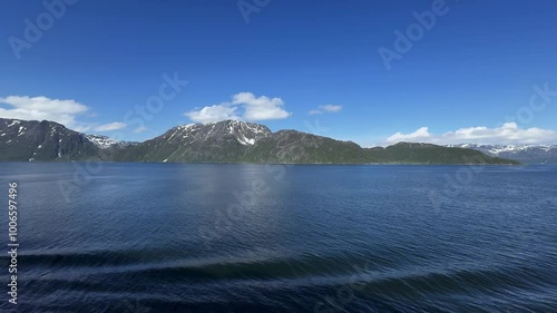 Kjerringfjordfjellet, Stjernøya, Alta Municipality, Finnmark, Norway - inhabited island in Altafjorden at strait of Stjernsundet and Sørøysundet as seen from passing cruise ship photo