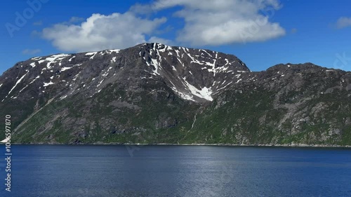 Stjernøya, Stierdná, Alta Municipality, Finnmark, Norway - river Láttu mountain slope formed by glacier melted snow flows into valley as waterfall photo