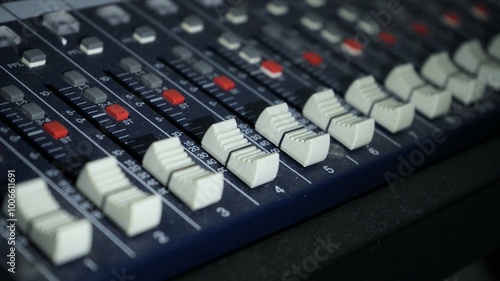 Professional sound and audio mixer control panel with buttons and sliders