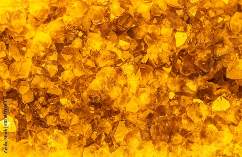 Golden crystal mineral stone. Gems. Mineral crystals in the natural environment. Texture of precious and semiprecious stones. Seamless background with copy space. photo