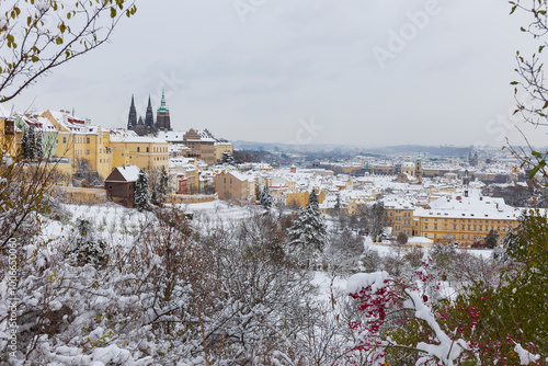 Snowy Prague City with gothic Castle from the Hill Petrin, Czech republic 