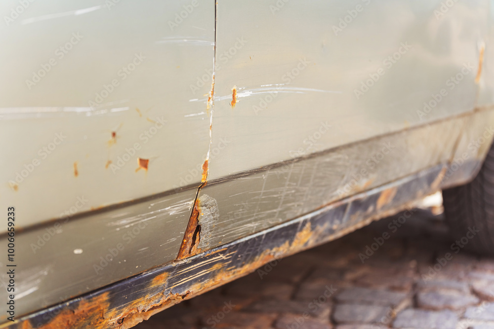 Closeup of a rusty car with a yellow light on its side Closeup of a rusty car with a yellow light on its side