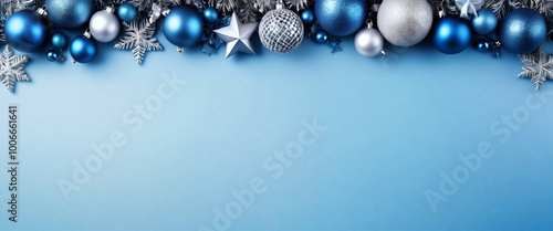Christmas border composition on a pastel blue background with copy space