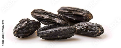 Black Tonka beans isolated on white background