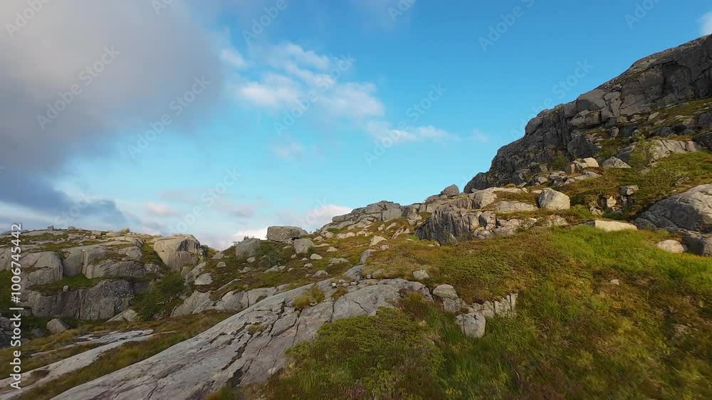 Diving a beautiful mountain crest over Preikestolen or Pulpit Rock at sunset, in Norway. 4K. Diving a beautiful mountain crest over Preikestolen or Pulpit Rock at sunset, in Norway. 4K.
