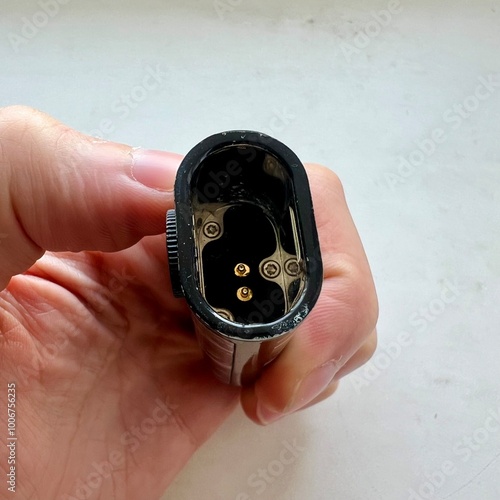 hand holding a gold ring