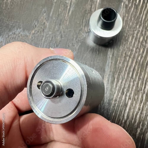 close up of a hand holding a battery