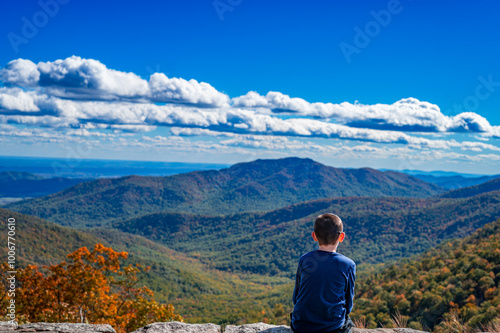 a boy enjoying Shenandoah mountains at a scenic overlook photo