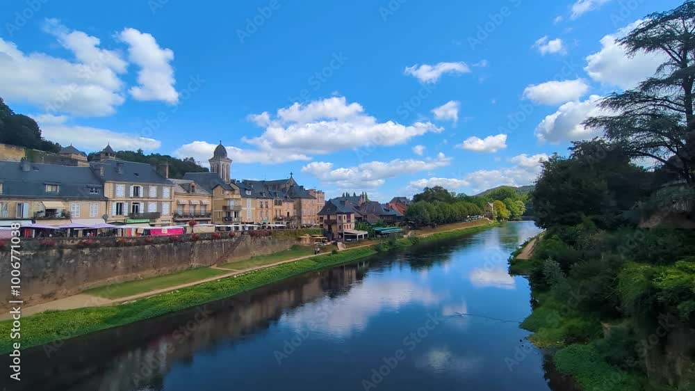 Ultra Wide Shot in Montignac-Lascaux Historic French Market Town on Hot Summer Day with Calm Tranquil Vézère River with Stalls Selling Fresh Goods with Old Buildings 4K Ultra Wide Shot in Montignac-Lascaux Historic French Market Town on Hot Summer Day with Calm Tranquil Vézère River with Stalls Selling Fresh Goods with Old Buildings 4K