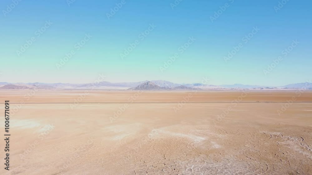 Drone push in on Nevada dry lake bed on a sunny summer day Drone push in on Nevada dry lake bed on a sunny summer day