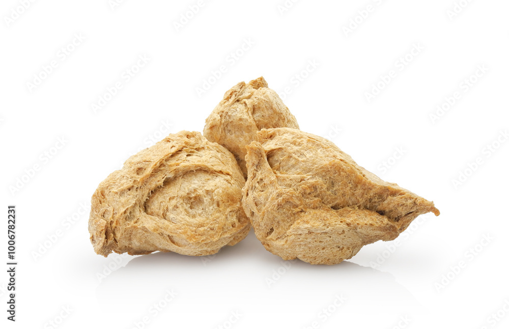 Textured soy chunks, vegetable protein for healthy life. Dry vegan meat isolated on white background. Textured soy chunks, vegetable protein for healthy life. Dry vegan meat isolated on white background.