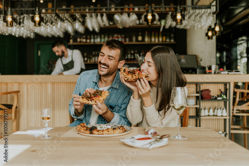 Enjoying delicious pizza to...
