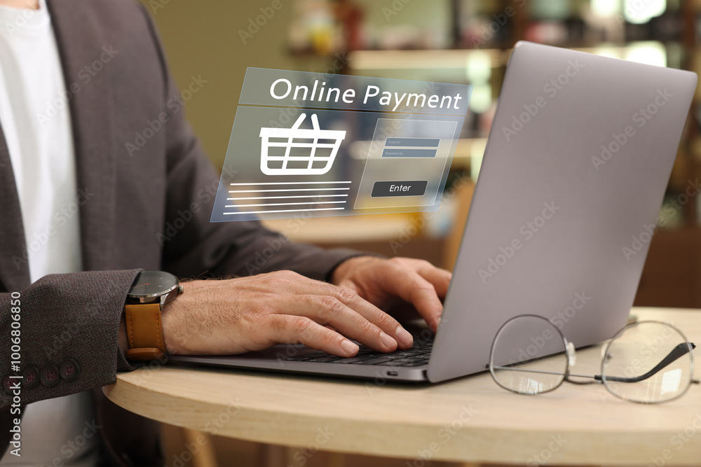 Online payment system interface over computer. Man working on laptop at table, closeup Online payment system interface over computer. Man working on laptop at table, closeup