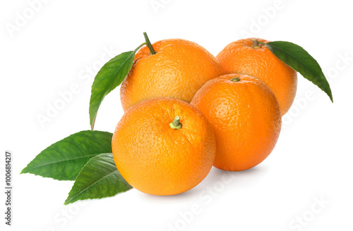 Fresh ripe oranges and green leaves on white background. Citrus fruit