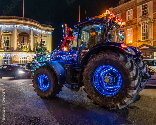 tractor on the road decorated with lights for Christmas