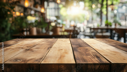 Wooden table in the foreground with a blurred background of a cozy bar with warm lighting.