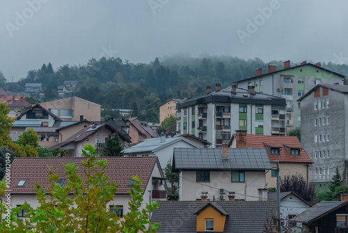 Obraz na płótnie Different residental houses in Trbovlje, Slovenia, scattered on a hill. Cloudy rainy day in early autumn. w salonie