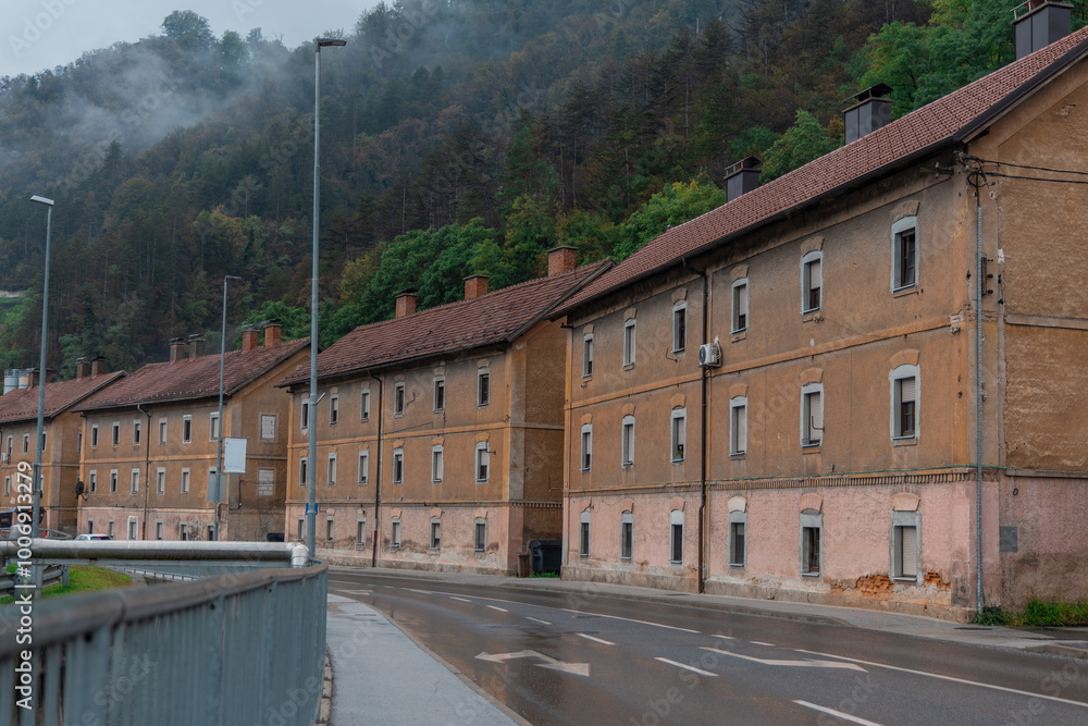 Typical houses in downtown trbovlje. Brick brown houses are a typical sight when entering Trbovlje. Houses for miners and workers, rainy day.