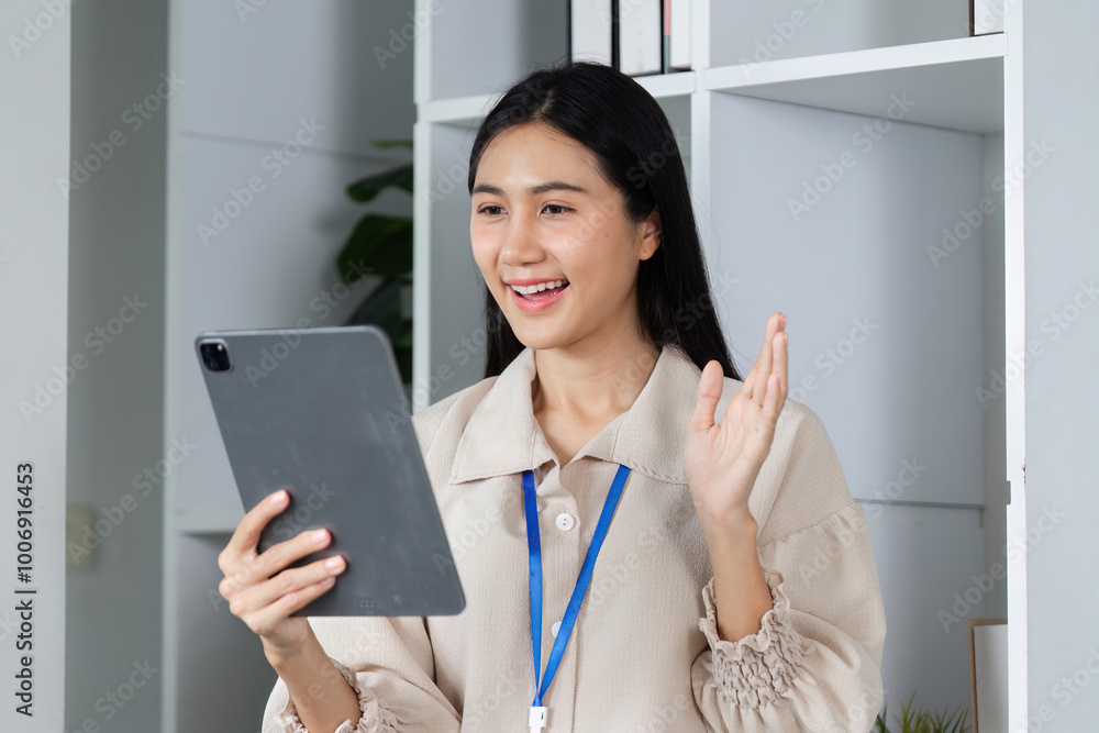 Young Accountant Holding Tablet Communicating with Clients in Modern Office Setting, Professional Business Interaction, Remote Work Concept Young Accountant Holding Tablet Communicating with Clients in Modern Office Setting, Professional Business Interaction, Remote Work Concept