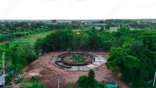 A Thai temple in Prakhon Chai district is surrounded by a verdant garden.