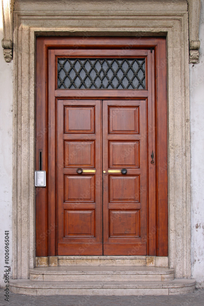 Brown Wood Double Doors With Silver Intercom House Entrance in Rome Italy Brown Wood Double Doors With Silver Intercom House Entrance in Rome Italy
