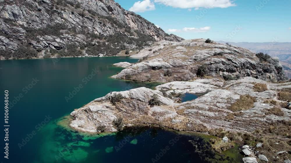 The Churup Lagoon with Turquoise Waters at the Foot of the Snow-Capped Cordillera Blanca is Located in the Huascaran National Park, in Ancash, Peru The Churup Lagoon with Turquoise Waters at the Foot of the Snow-Capped Cordillera Blanca is Located in the Huascaran National Park, in Ancash, Peru