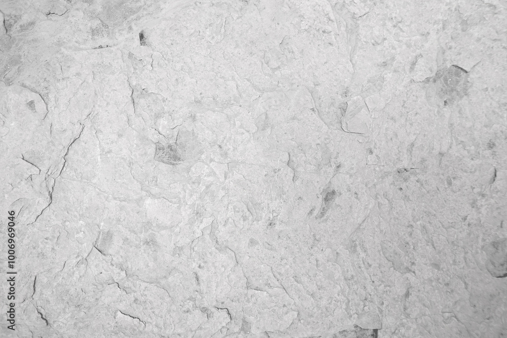 Light grey crack stone wall for abstract background and texture for interior or exterior design. Beautiful patterns, space for work, banner, wallpaper close up. Light grey crack stone wall for abstract background and texture for interior or exterior design. Beautiful patterns, space for work, banner, wallpaper close up.