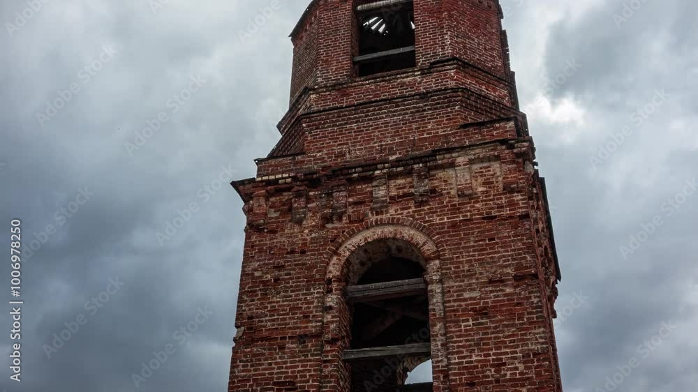 Ancient Bell Tower Against a Dynamic Time-Lapse of Dramatic Clouds and Cloudy Sky. Ancient Bell Tower Against a Dynamic Time-Lapse of Dramatic Clouds and Cloudy Sky.