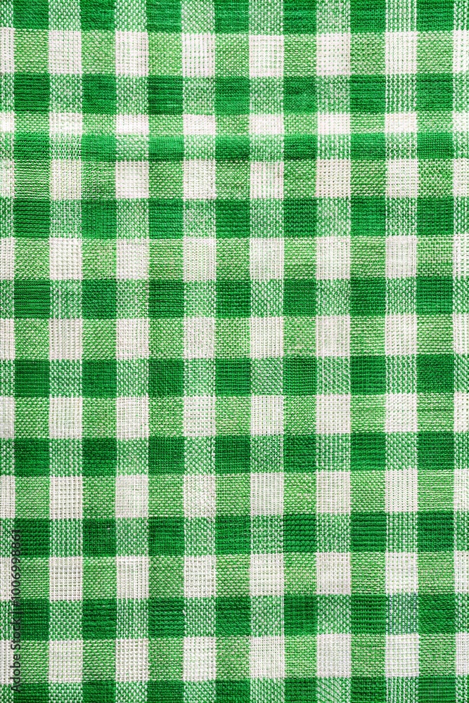 Fototapeta premium Green and white checkered fabric with a classic gingham pattern suitable for various home decor and crafting projects. Generative AI