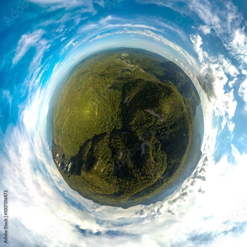 over the green forests of the mountains of the Western Caucasus (South of Russia) near the village of Guamka and the Guam gorge on a sunny summer day - small planet 360 aerial panorama photo