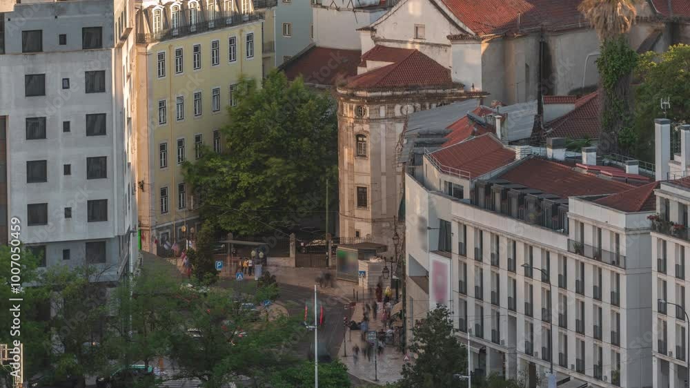 Aerial view of Martim Moniz Square timelapse in Lisbon, Portugal. Old tram stop on the street and road traffic. A bustling hub of culture and diversity, framed by historic architecture during sunset Aerial view of Martim Moniz Square timelapse in Lisbon, Portugal. Old tram stop on the street and road traffic. A bustling hub of culture and diversity, framed by historic architecture during sunset