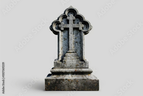 A stone cross sits atop a grave, often used in memorial services or as a symbol of remembrance