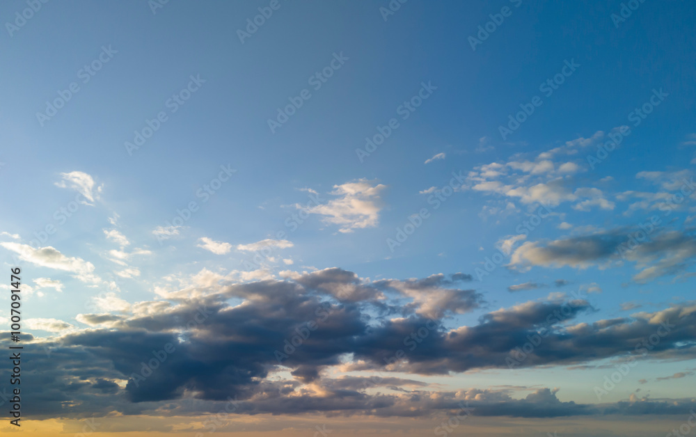 A stunning view of a partly cloudy sky during sunset, showcasing vibrant colors and dramatic clouds, perfect for nature lovers and those seeking serene outdoor imagery. A stunning view of a partly cloudy sky during sunset, showcasing vibrant colors and dramatic clouds, perfect for nature lovers and those seeking serene outdoor imagery.
