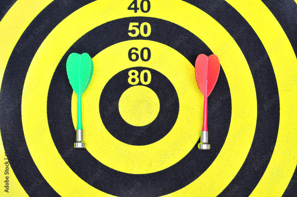 The magnetic needle darts in the center of the target.Concept of competition and goal achievement. The magnetic needle darts in the center of the target.Concept of competition and goal achievement.