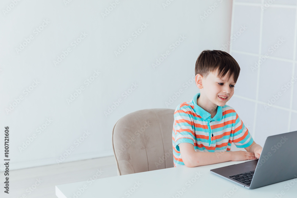 Schoolboy At Table With Laptop Online Learning Schoolboy At Table With Laptop Online Learning