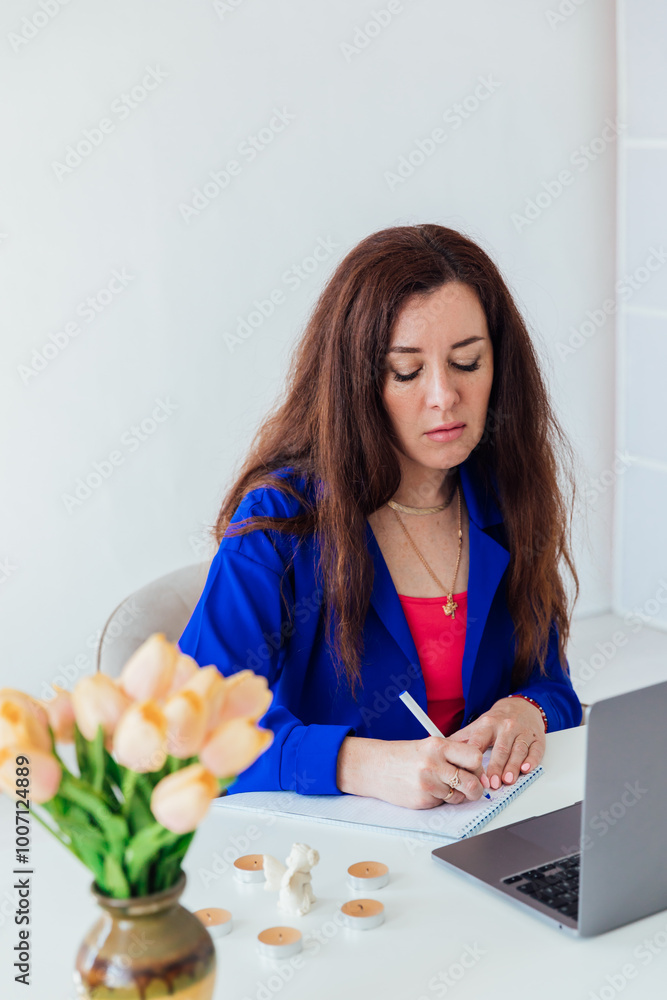 Business woman working at desk with laptop in office online Business woman working at desk with laptop in office online