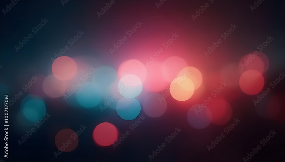 Blurred multicolor abstract lens flare on dark background. Defocused glow effect.