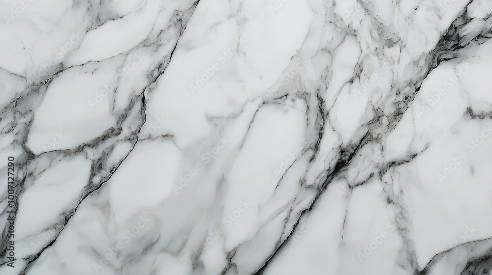 A marble tile showcasing intricate gray veins running through pristine white stone. This elegant design adds a touch of sophistication and natural beauty to any space A marble tile showcasing intricate gray veins running through pristine white stone. This elegant design adds a touch of sophistication and natural beauty to any space