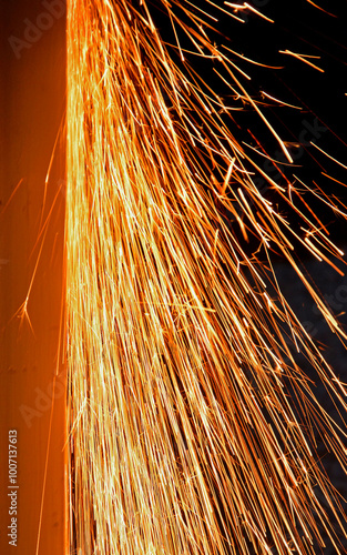 Obraz na płótnie iskry, pomarańczowe iskry, iskry ze szlifierki, orange sparks, sparks from the grinder, Sparks from cutting metal of angle grinder, spark from the grinding wheel w salonie