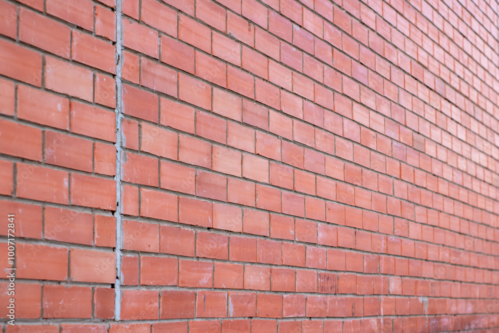 A detailed close up of a red brick wall covered in fresh snow on it A detailed close up of a red brick wall covered in fresh snow on it