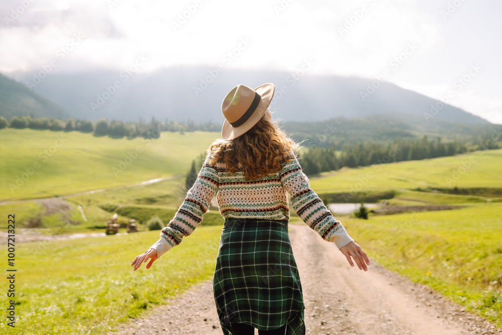 Naklejka premium Carefree woman basks in nature's beauty. Adventure and travel. Serenity Found